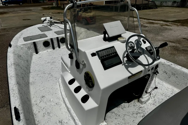 Slide: The Image of 2007 Haynie 23 Bigfoot boat with steering console and navigation equipment. - 13