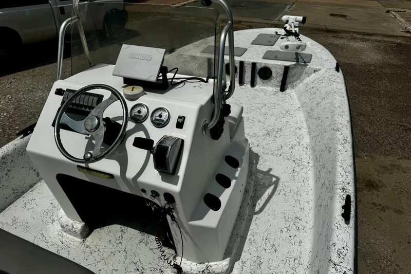 Slide: The Image of 2007 Haynie 23 Bigfoot boat interior with steering wheel and control panel. - 15