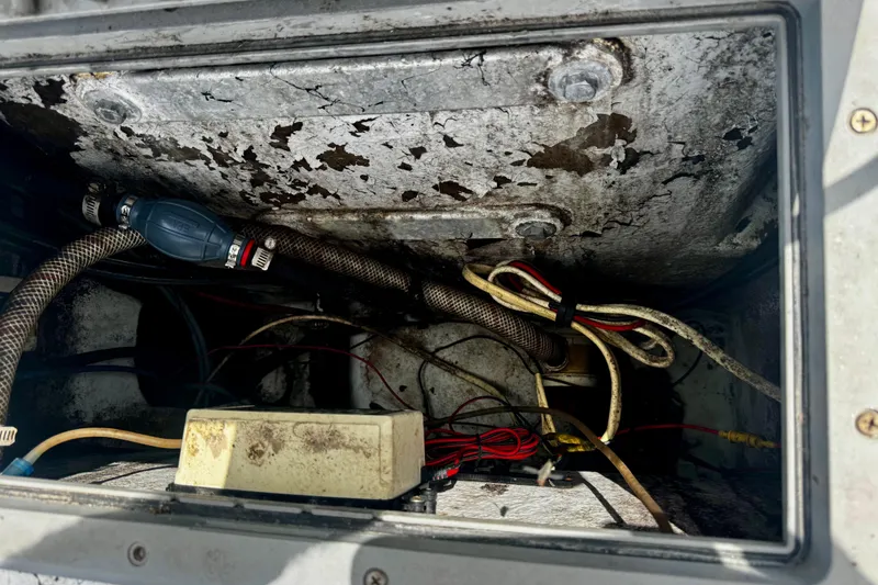 Slide: The Image of Electrical compartment of a 2007 Haynie 23 Bigfoot boat showing wiring and hoses. - 19