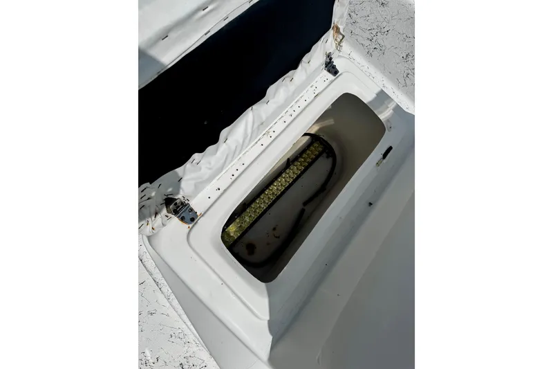 Slide: The Image of Open storage compartment on a 2007 Haynie 23 Bigfoot boat, showing interior details. - 21
