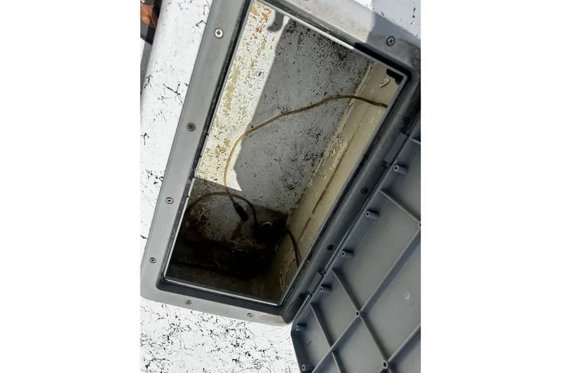 Slide: The Image of Open storage compartment on a 2007 Haynie 23 Bigfoot boat, showing interior details. - 22