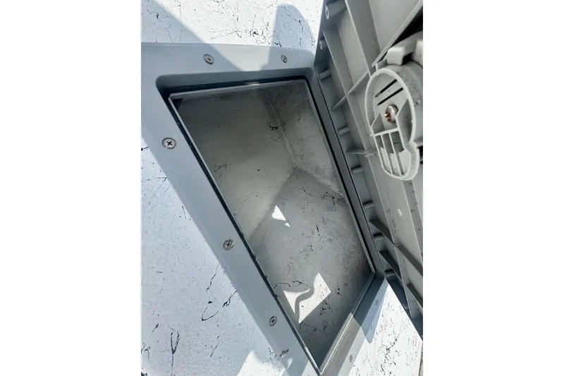 Slide: The Image of Open storage compartment on a 2007 Haynie 23 Bigfoot boat, showing interior details. - 24