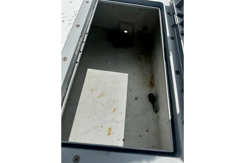 Slide: The Image of Open storage compartment in 2007 Haynie 23 Bigfoot boat, showing interior details. - 26