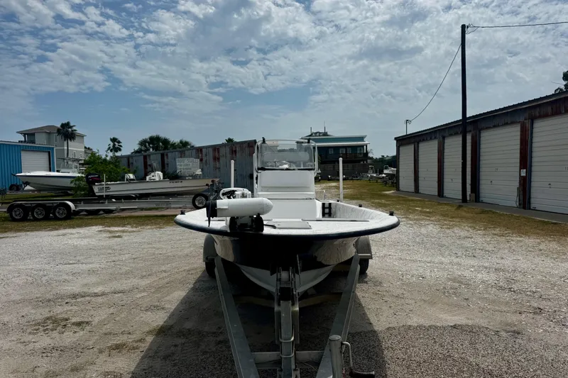 Slide: The Image of 2007 Haynie 23 Bigfoot boat on trailer in outdoor storage area under cloudy sky. - 4