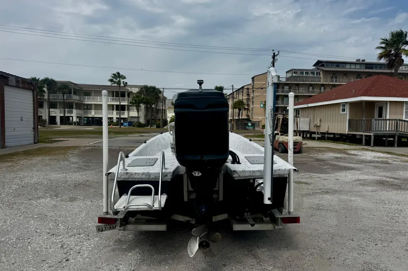 Slide: The Image of 2007 Haynie 23 Bigfoot boat on trailer, parked in residential area. - 5