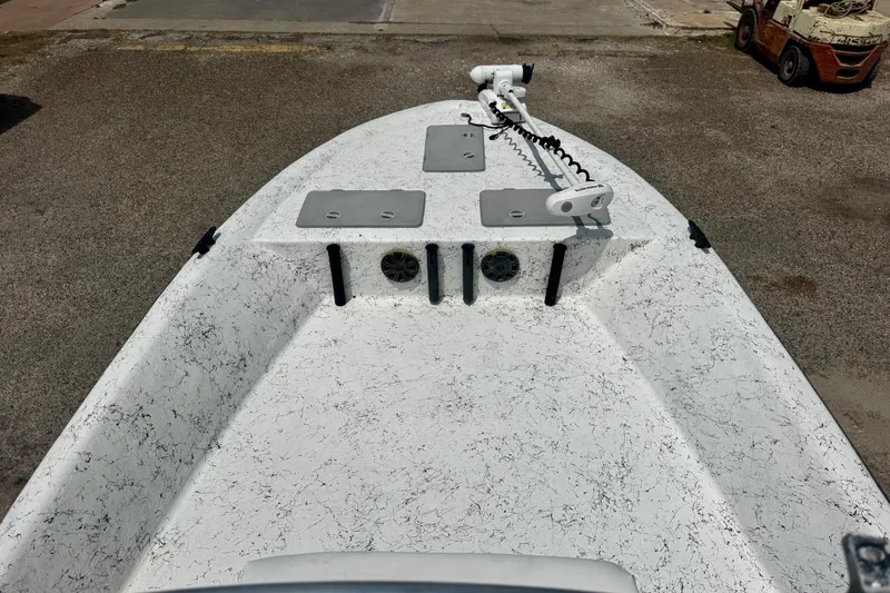 Slide: The Image of 2007 Haynie 23 Bigfoot boat deck with trolling motor and storage compartments. - 8