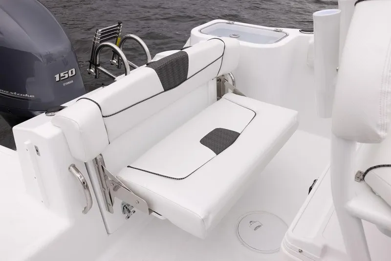 Slide: The Image of 2023 Wellcraft 222 Fisherman boat interior with Yamaha 150 engine, featuring white seating. - 13