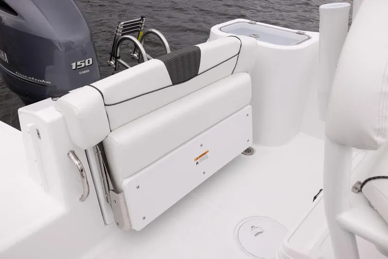Slide: The Image of 2023 Wellcraft 222 Fisherman boat interior with Yamaha 150 engine, featuring white seating. - 14