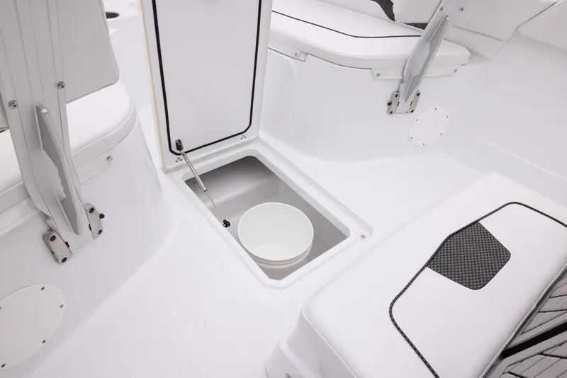 Slide: The Image of 2023 Wellcraft 222 Fisherman boat interior with storage compartment and seating. - 16