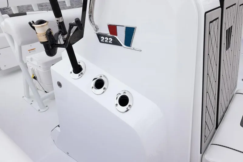 Slide: The Image of 2023 Wellcraft 222 Fisherman boat interior with rod holders and storage compartments. - 17