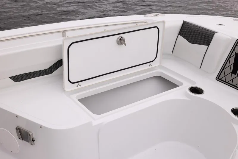 Slide: The Image of 2023 Wellcraft 222 Fisherman boat storage compartment and seating area. - 21