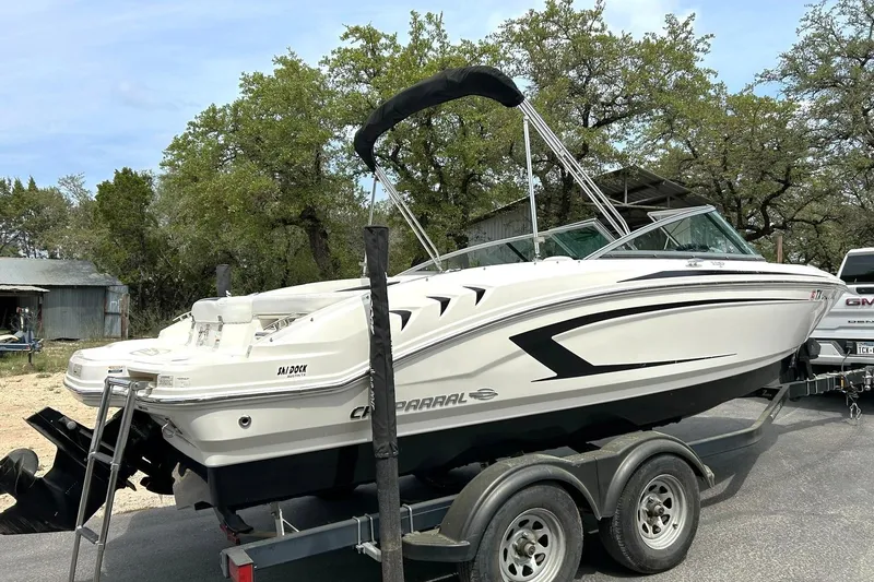 Slide: The Image of 2016 Chaparral 21 H2O Sport boat on trailer, parked outdoors. - 14