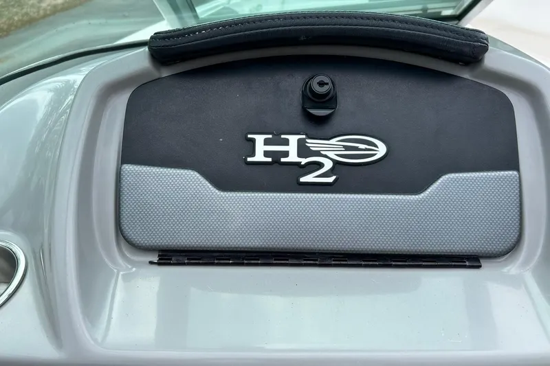 Slide: The Image of 2016 Chaparral 21 H2O Sport dashboard with H2O emblem detail. - 32