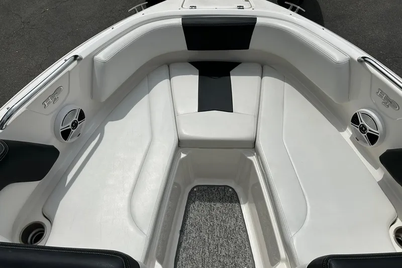 Slide: The Image of Interior view of 2016 Chaparral 21 H2O Sport boat with white seating and speakers. - 40