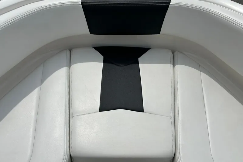 Slide: The Image of 2016 Chaparral 21 H2O Sport boat interior with white and black seating. - 41