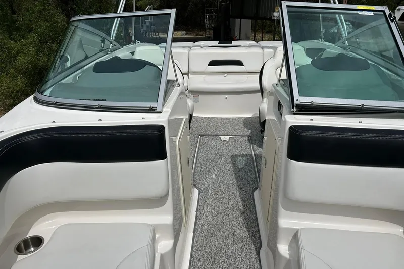 Slide: The Image of 2016 Chaparral 21 H2O Sport boat interior with open windshield and seating area. - 47