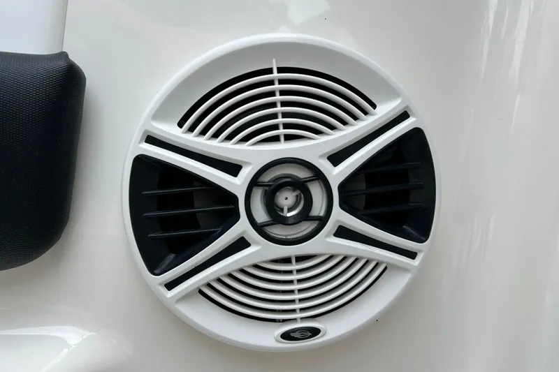 Slide: The Image of White speaker on 2016 Chaparral 21 H2O Sport boat, featuring black accents. - 48