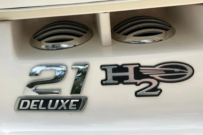 Slide: The Image of 2016 Chaparral 21 H2O Sport Deluxe emblem with chrome accents. - 54