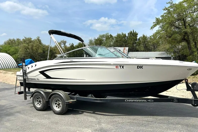 Slide: The Image of 2016 Chaparral 21 H2O Sport boat on trailer, parked outdoors. - 7
