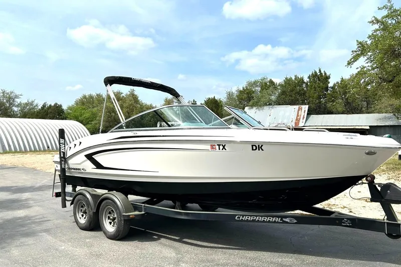 Slide: The Image of 2016 Chaparral 21 H2O Sport boat on trailer, parked outdoors. - 8