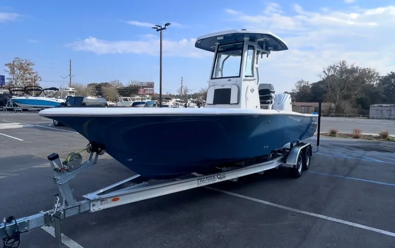 Slide: The Image of 2026 Tidewater 2500 Carolina Bay boat on trailer outdoors. - 7