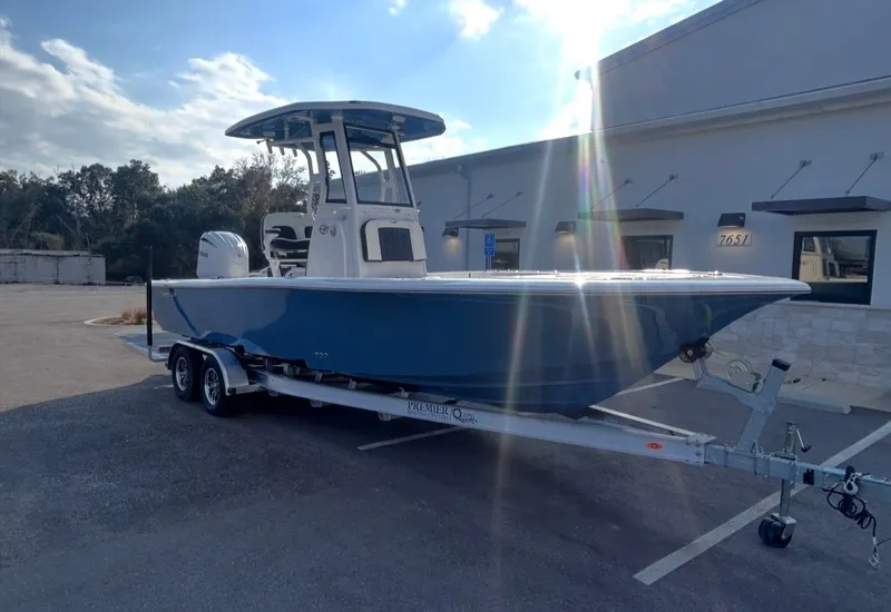 Slide: The Image of 2026 Tidewater 2500 Carolina Bay boat on trailer outdoors. - 8