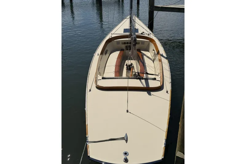 Slide: The Image of 2014 C.W. Hood 32 Daysailer docked, showcasing sleek design and spacious deck. - 16