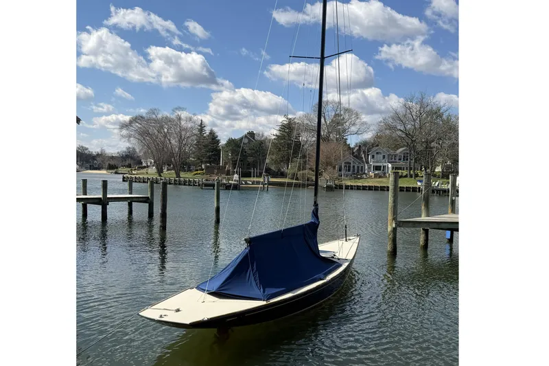 Slide: The Image of Sailboat docked on a serene lake, C.W. Hood 32 Daysailer, 2014 model. - 3