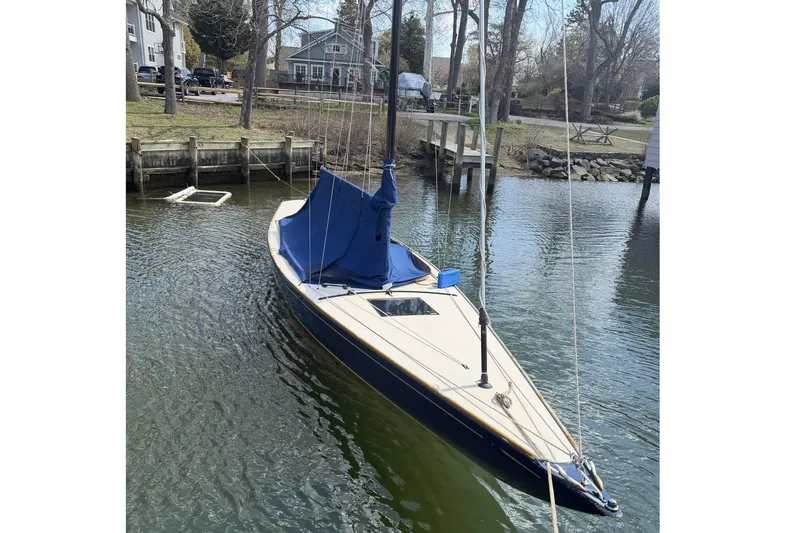 Slide: The Image of 2014 C.W. Hood 32 Daysailer docked in a serene waterfront setting. - 4