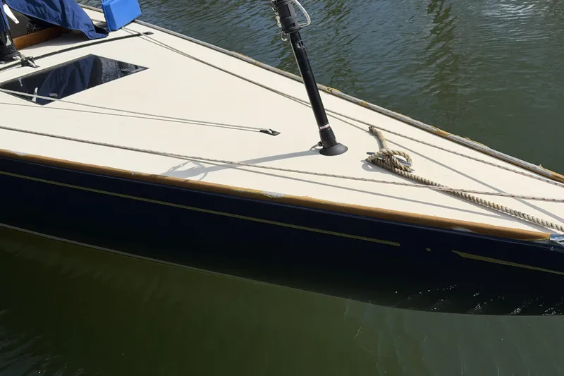 Slide: The Image of C.W. Hood 32 Daysailer 2014, sleek design, docked on calm water. - 5