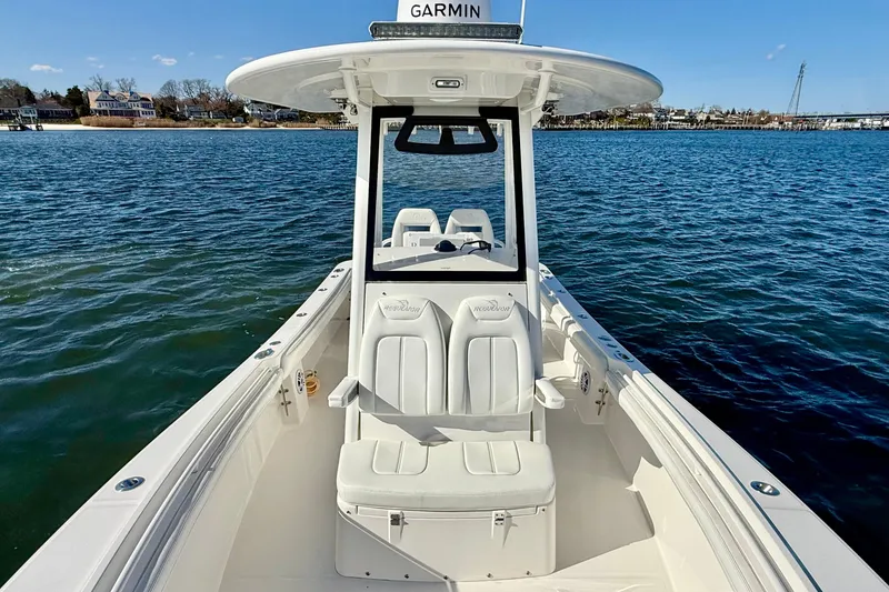 Slide: The Image of 2022 Regulator 23 boat on water, featuring sleek design and Garmin navigation system. - 24