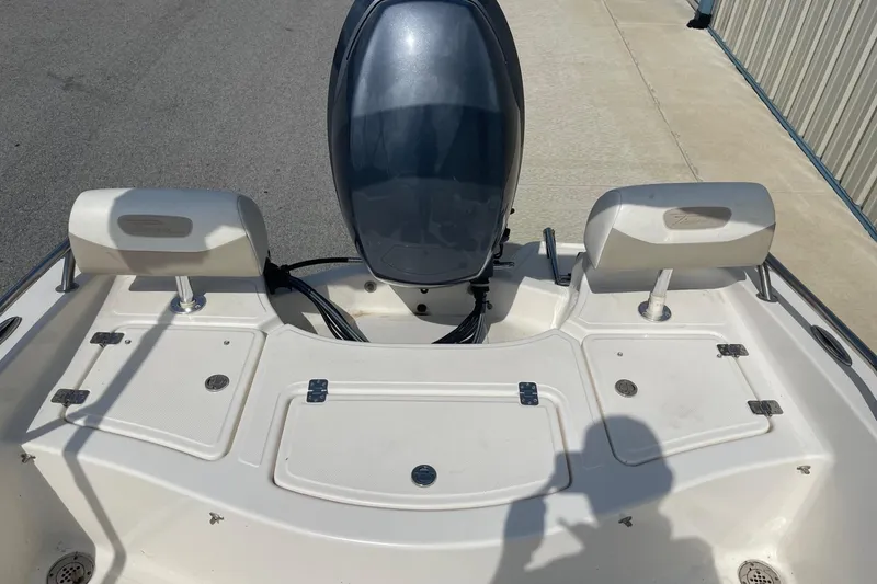 Slide: The Image of 2013 Pioneer 175 Venture boat deck with motor and storage compartments. - 12