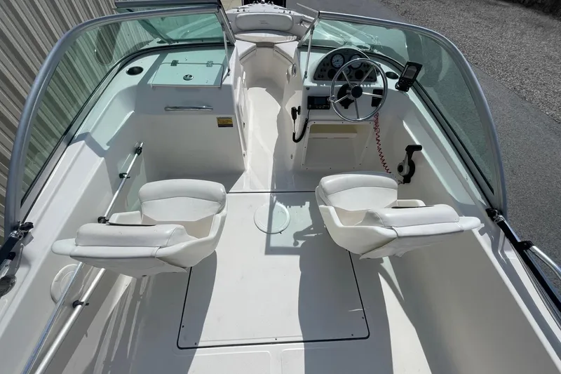 Slide: The Image of Interior of 2013 Pioneer 175 Venture boat with steering wheel and seating. - 15