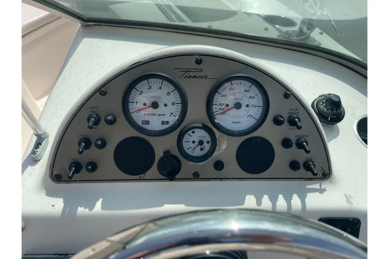 Slide: The Image of Dashboard of a 2013 Pioneer 175 Venture boat with gauges and controls. - 19