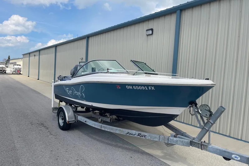 Slide: The Image of 2013 Pioneer 175 Venture boat on trailer near storage facility. - 2
