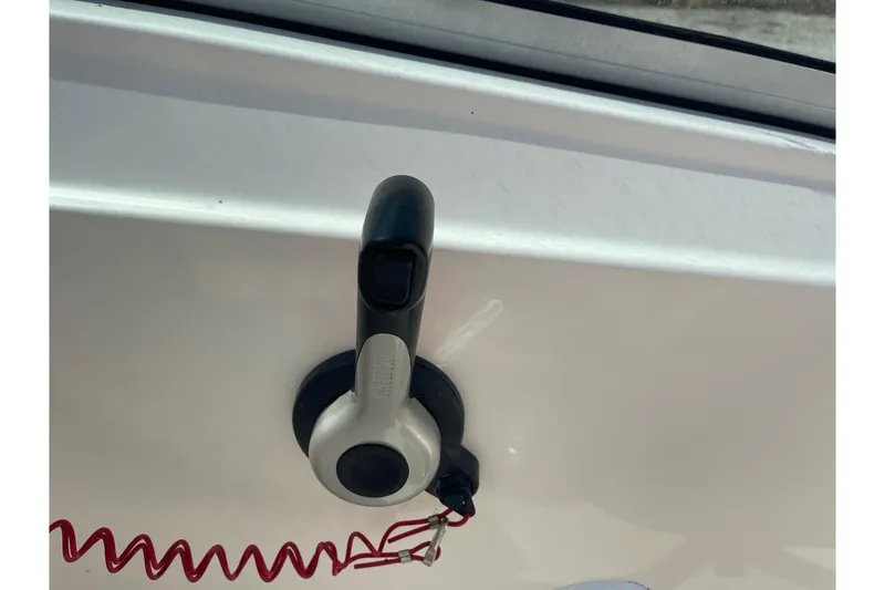 Slide: The Image of Boat throttle control on a 2013 Pioneer 175 Venture with red safety cord. - 21