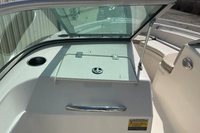 Slide: The Image of 2013 Pioneer 175 Venture boat interior with windshield and storage compartment. - 23