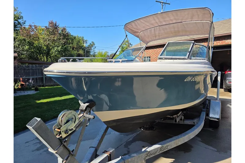 Slide: The Image of 2013 Pioneer 175 Venture boat on trailer in driveway, sunny day. - 28