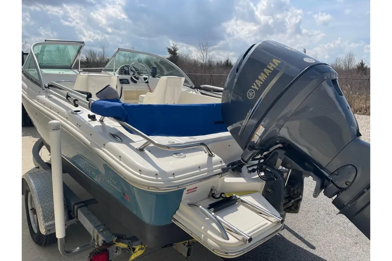 Slide: The Image of 2013 Pioneer 175 Venture boat with Yamaha outboard motor, parked on a trailer under a cloudy sky. - 4