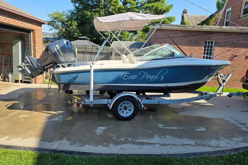 Slide: The Image of 2013 Pioneer 175 Venture boat named "Erie Pearl" on a trailer in a driveway. - 7