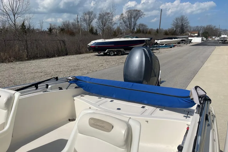 Slide: The Image of 2013 Pioneer 175 Venture boat with outboard motor, parked on a sunny day. - 9