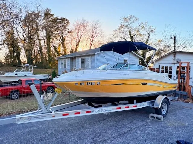 The Image of 2007 Sea Ray 185 boat on trailer parked in front of house. - 0