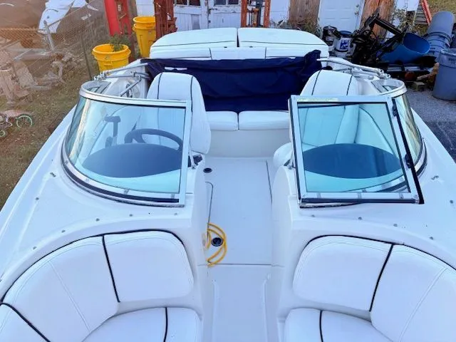 Slide: The Image of Interior view of a 2007 Sea Ray 185 boat with white seating. - 11
