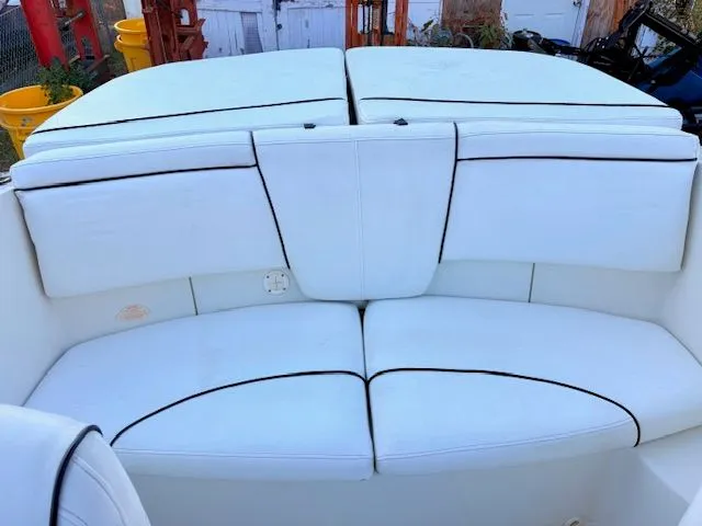 Slide: The Image of Interior of a 2007 Sea Ray 185 boat with white upholstery. - 14