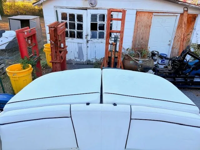 Slide: The Image of Rear view of a 2007 Sea Ray 185 boat near a garage. - 15