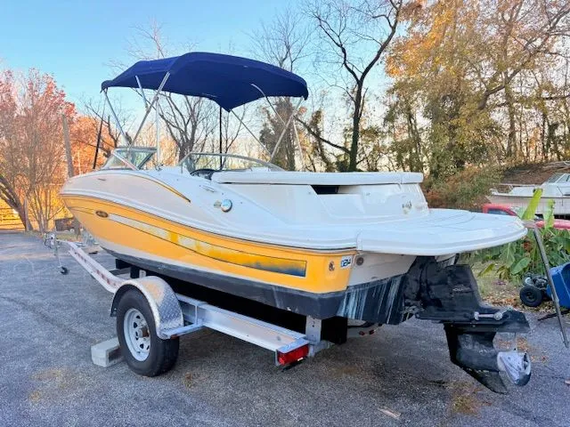 Slide: The Image of Yellow 2007 Sea Ray 185 boat on trailer outdoors. - 2