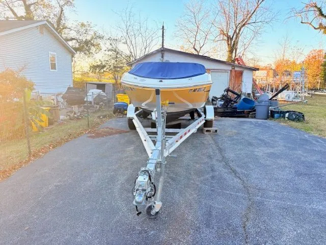 Slide: The Image of 2007 Sea Ray 185 boat on trailer parked in driveway. - 5