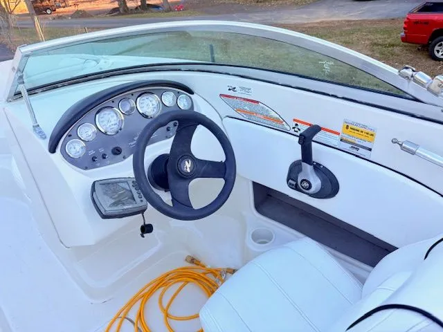 Slide: The Image of Interior view of a 2007 Sea Ray 185 boat cockpit with steering and instruments. - 7