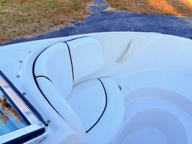 Slide: The Image of Interior view of a 2007 Sea Ray 185 boat with white seating. - 9