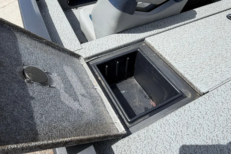 Slide: The Image of Open storage compartment on 2022 G3 Sportsman 1710 boat, showcasing interior space. - 13
